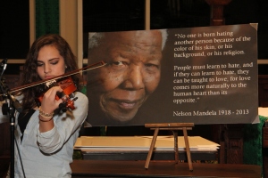Sophie playing violin for "Nothing More" following Chad's story of Nelson Mandela